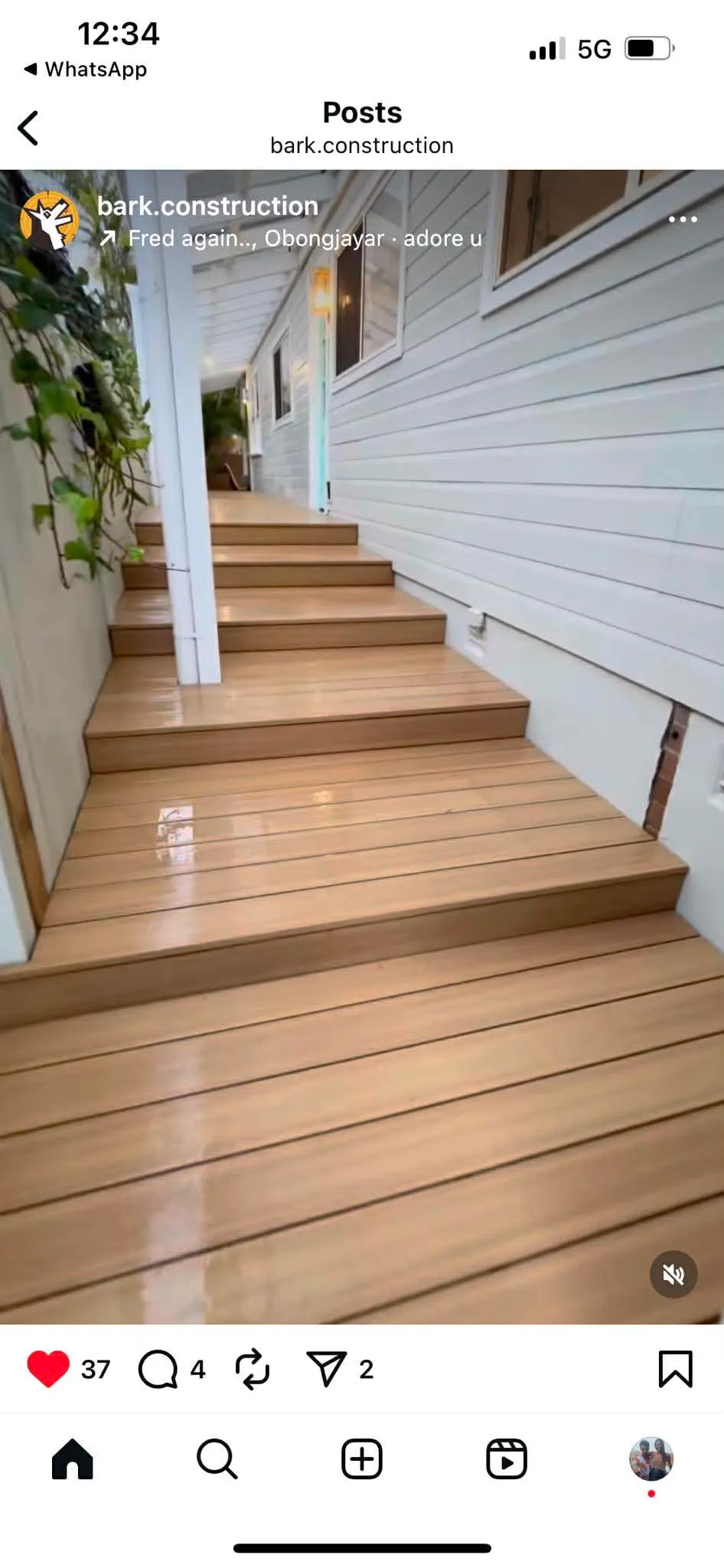 Long timber deck with wide stair landings beside weatherboard coastal home