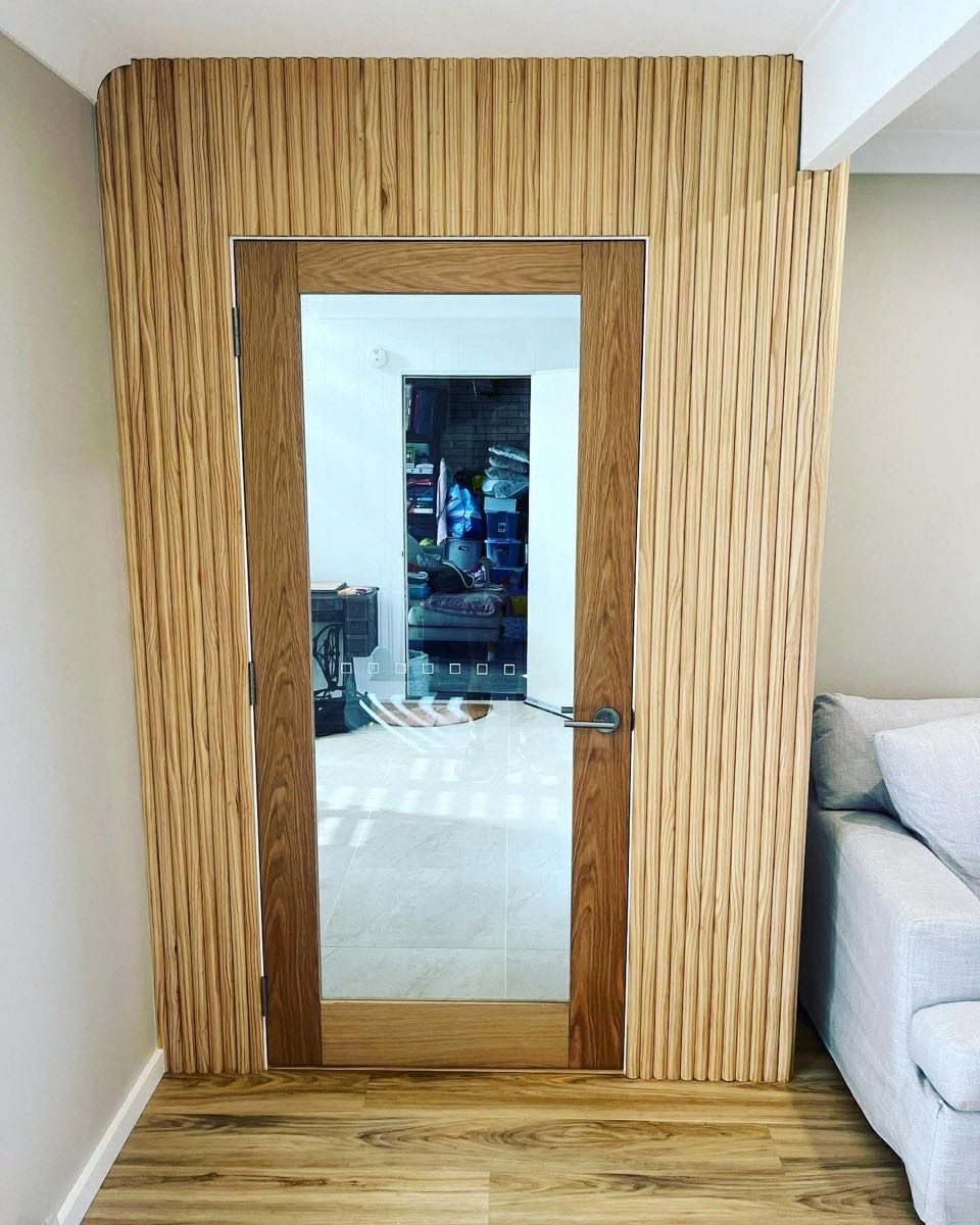 Custom timber VJ panel door with glass insert