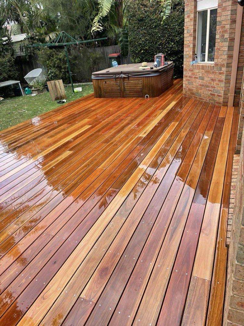 Freshly oiled hardwood timber deck