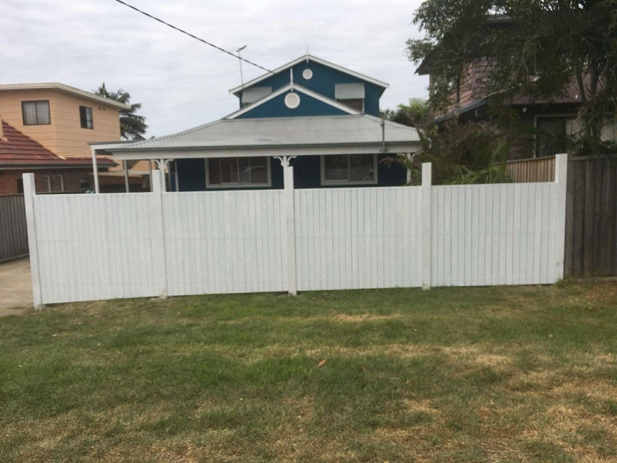 White painted timber privacy fence