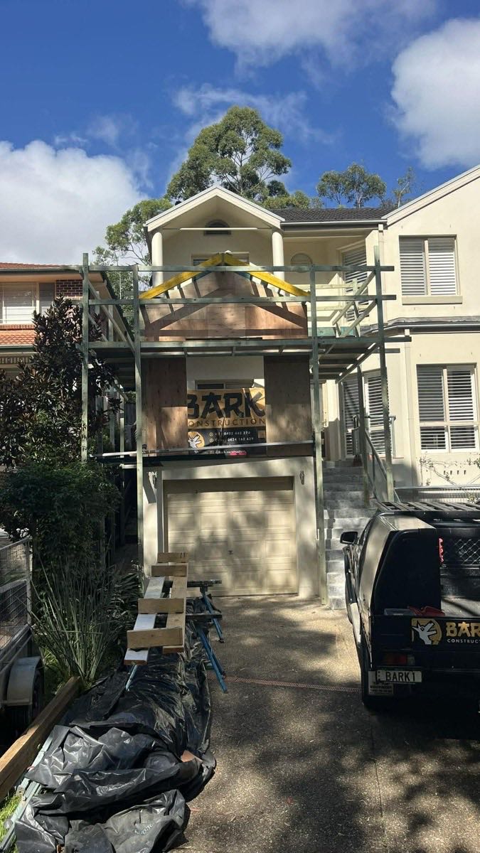 Bark Construction branded van and scaffolding on site